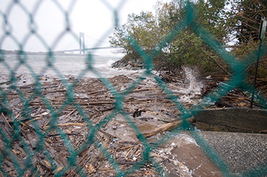 Wood and other debris slams onto the shore of Staten Island, N.Y., as Hurricane Sandy approaches in New York Harbor, Oct. 29, 2012.